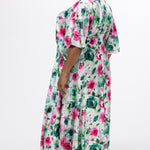 Celebration's by Sydney's Closet style CE2619 in floral. 

Empire waist, satin plus size floral gown with surplice bodice, V-neck and elbow length sleeves. Ankle length A-line skirt, center back zipper and pockets.  Includes optional belt. 