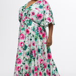 Celebration's by Sydney's Closet style CE2619 in floral. 

Empire waist, satin plus size floral gown with surplice bodice, V-neck and elbow length sleeves. Ankle length A-line skirt, center back zipper and pockets.  Includes optional belt. 