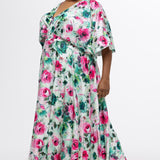 Celebration's by Sydney's Closet style CE2619 in floral. 

Empire waist, satin plus size floral gown with surplice bodice, V-neck and elbow length sleeves. Ankle length A-line skirt, center back zipper and pockets.  Includes optional belt. 