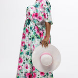 Celebration's by Sydney's Closet style CE2619 in floral. 

Empire waist, satin plus size floral gown with surplice bodice, V-neck and elbow length sleeves. Ankle length A-line skirt, center back zipper and pockets.  Includes optional belt. 