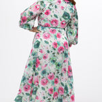 Celebration's by Sydney's Closet style CE2621 in floral. 

Button down plus size ankle length floral gown made from printed organza. V-neck, long pouf sleeves with cuff and optional belt. A-line skirt with pockets. 