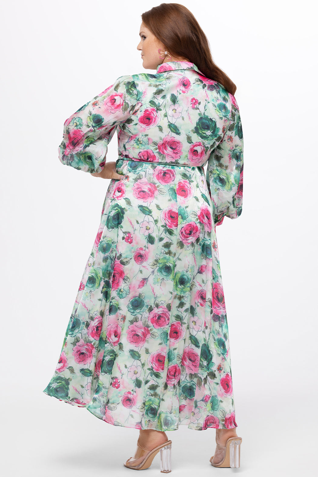Celebration's by Sydney's Closet style CE2621 in floral. 

Button down plus size ankle length floral gown made from printed organza. V-neck, long pouf sleeves with cuff and optional belt. A-line skirt with pockets. 