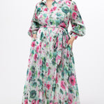 Celebration's by Sydney's Closet style CE2621 in floral. 

Button down plus size ankle length floral gown made from printed organza. V-neck, long pouf sleeves with cuff and optional belt. A-line skirt with pockets.