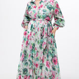 Celebration's by Sydney's Closet style CE2621 in floral. 

Button down plus size ankle length floral gown made from printed organza. V-neck, long pouf sleeves with cuff and optional belt. A-line skirt with pockets.