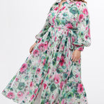 Celebration's by Sydney's Closet style CE2621 in floral. 

Button down plus size ankle length floral gown made from printed organza. V-neck, long pouf sleeves with cuff and optional belt. A-line skirt with pockets.