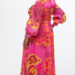 Celebration's by Sydney's Closet style CE2622 in abstract print. 

Button down plus size ankle length gown made from printed organza. V-neck, long pouf sleeves with cuff and optional belt. A-line skirt with pockets.