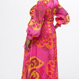 Celebration's by Sydney's Closet style CE2622 in abstract print. 

Button down plus size ankle length gown made from printed organza. V-neck, long pouf sleeves with cuff and optional belt. A-line skirt with pockets.