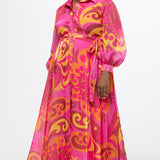 Celebration's by Sydney's Closet style CE2622 in abstract print. 

Button down plus size ankle length gown made from printed organza. V-neck, long pouf sleeves with cuff and optional belt. A-line skirt with pockets.