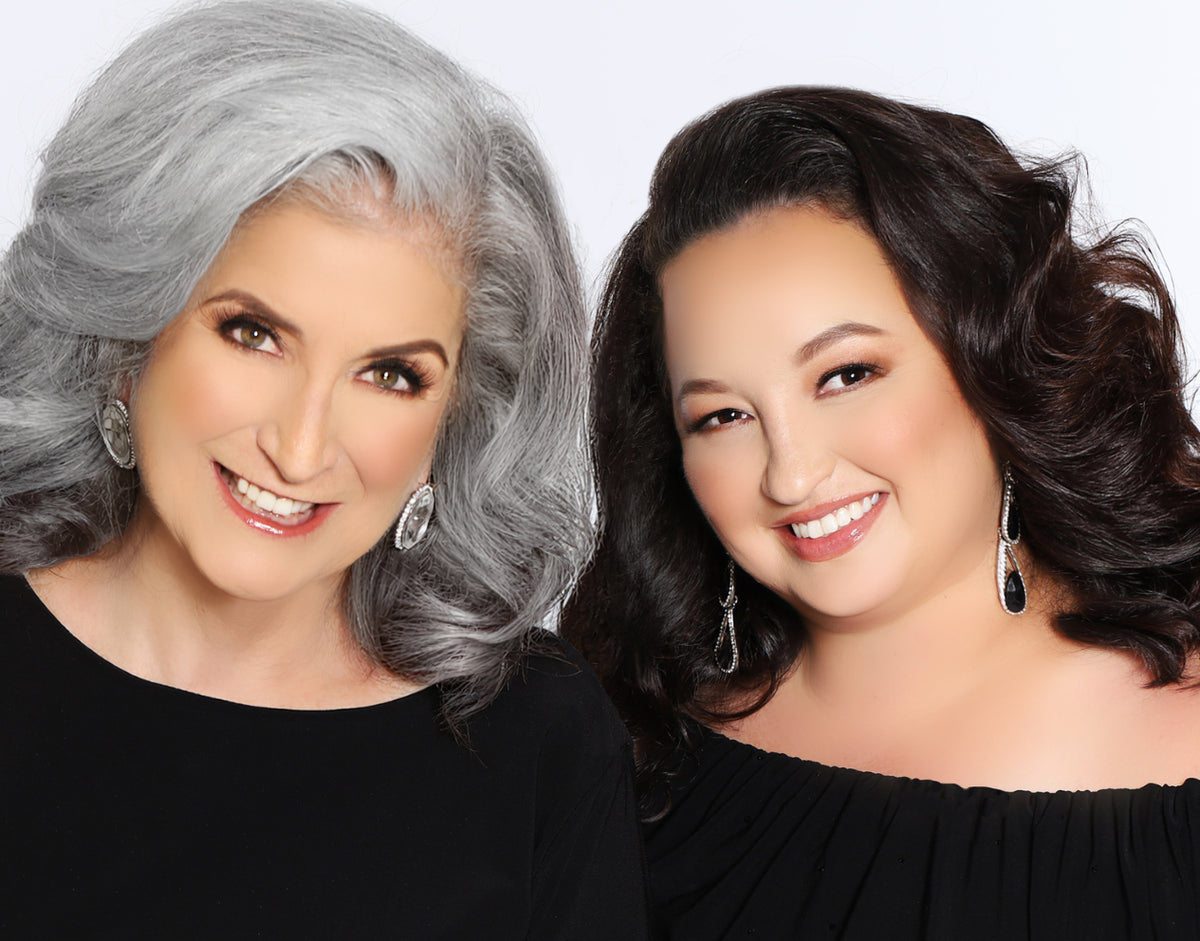 Two women with styled hair against a white background