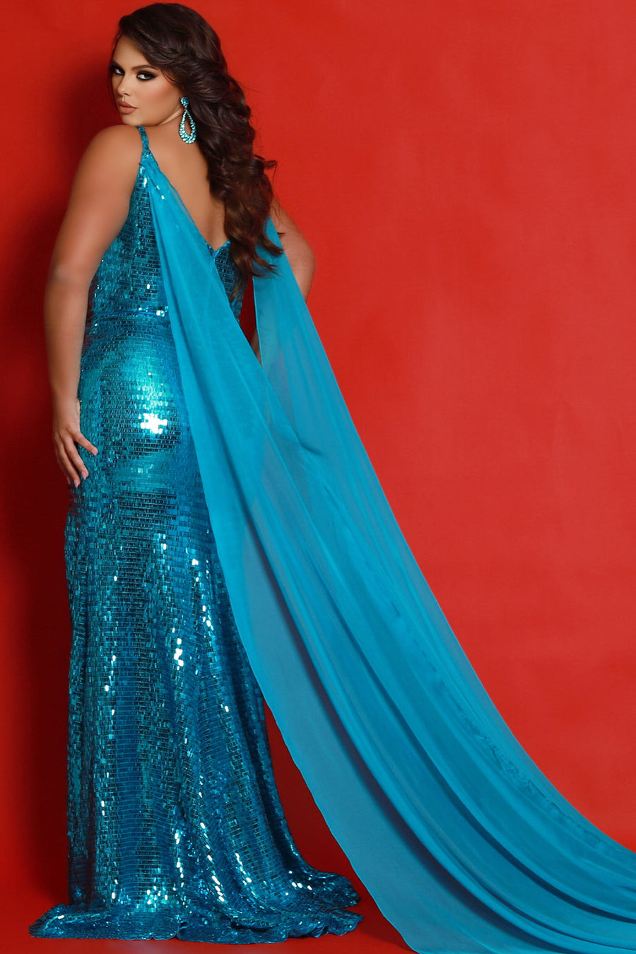 Johnathan Kayne for Sydney's Closet JK2413 Turquoise. Princess line silhouette, Slim fit, Piano sequins, V-back, Center back zipper, Deep V-neckline, Nude mesh insert, Spaghetti straps covered in piano sequins, Detachable chiffon cape = 105 inches from shoulder to hem, Piano sequins, High slit, Sweep train with godet.