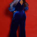 Johnathan Kayne for Sydney's Closet JK2414 Royal. Jumpsuit, Stretch velvet, Organza puff sleeve, Cuff = 4 inches, Invisible zipper on inside wrist of cuff, QTY 3 decorative crystals, Bell bottom pants, Pockets, Diamond cut out back, Center back zipper.