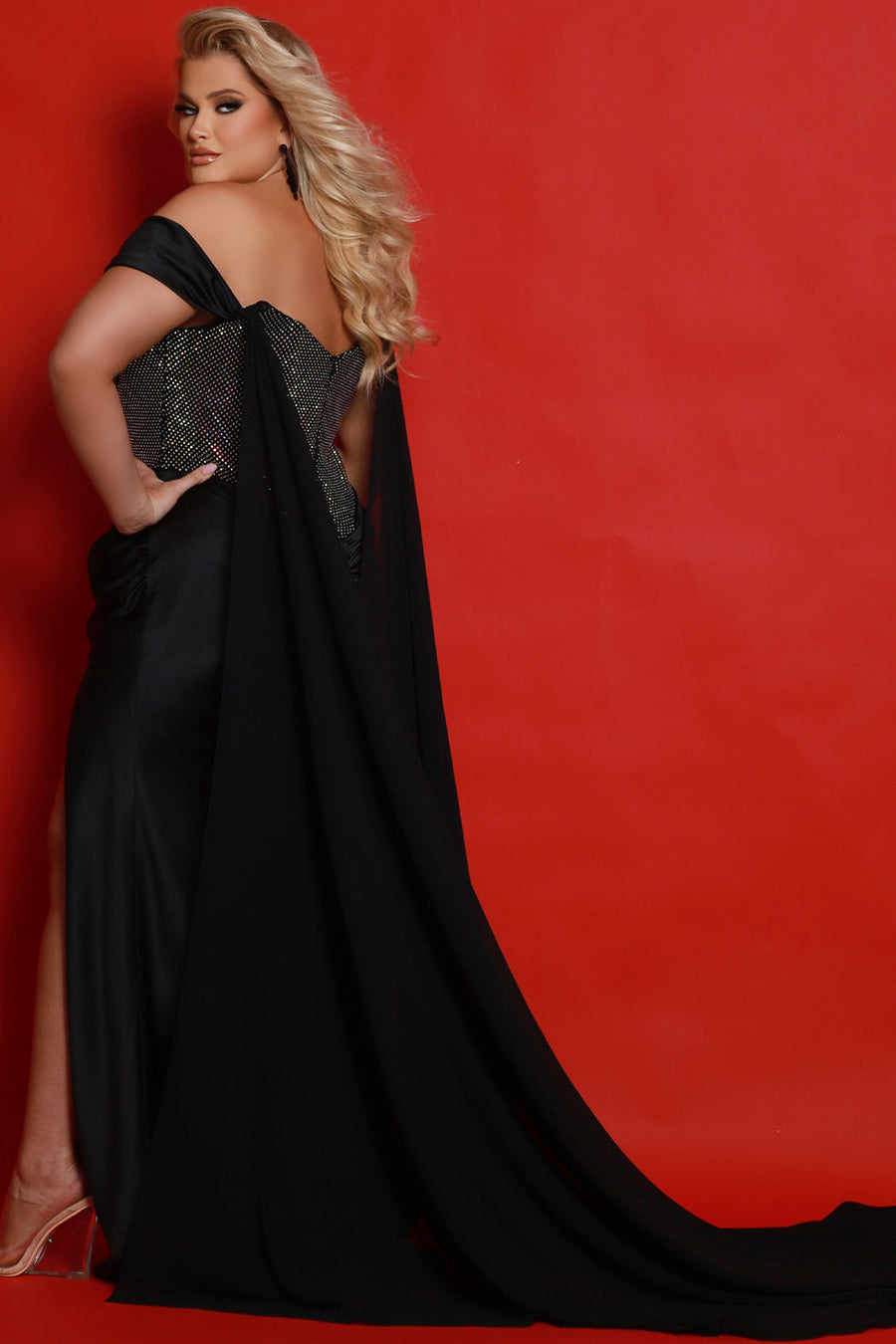 Johnathan Kayne for Sydney's Closet JK2417 Onyx. Stretch satin, stretch crystal mesh Slim, Fitted silhouette, Sweetheart neckline, Off-the-shoulder sleeve, Bustier exposed boning on front and back of bodice, Pleated detail over bodice, Basque waistline, Ruched waist and buttocks, Fitted skirt with slit, Sweep train, Detachable chiffon cape, Detachable crystal mesh spaghetti straps.