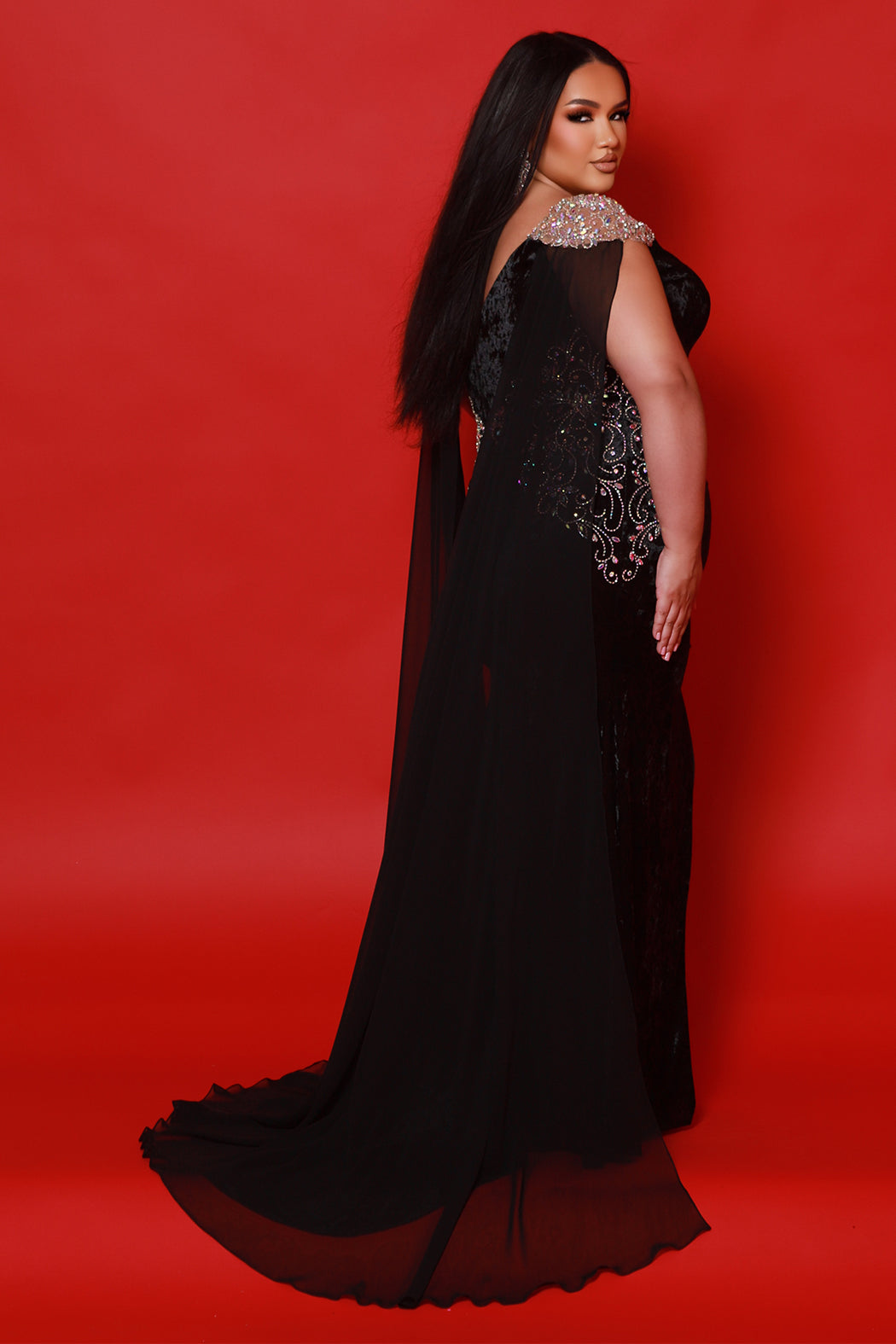 Crushed velvet plus size formal evening dress with slit, AB hot fix stones, cap sleeve and detachable cape. Available in black, cobalt blue or white with AB cut stones.  Chiffon cape included. Johnathan Kayne for Sydney's Closet style JK2515