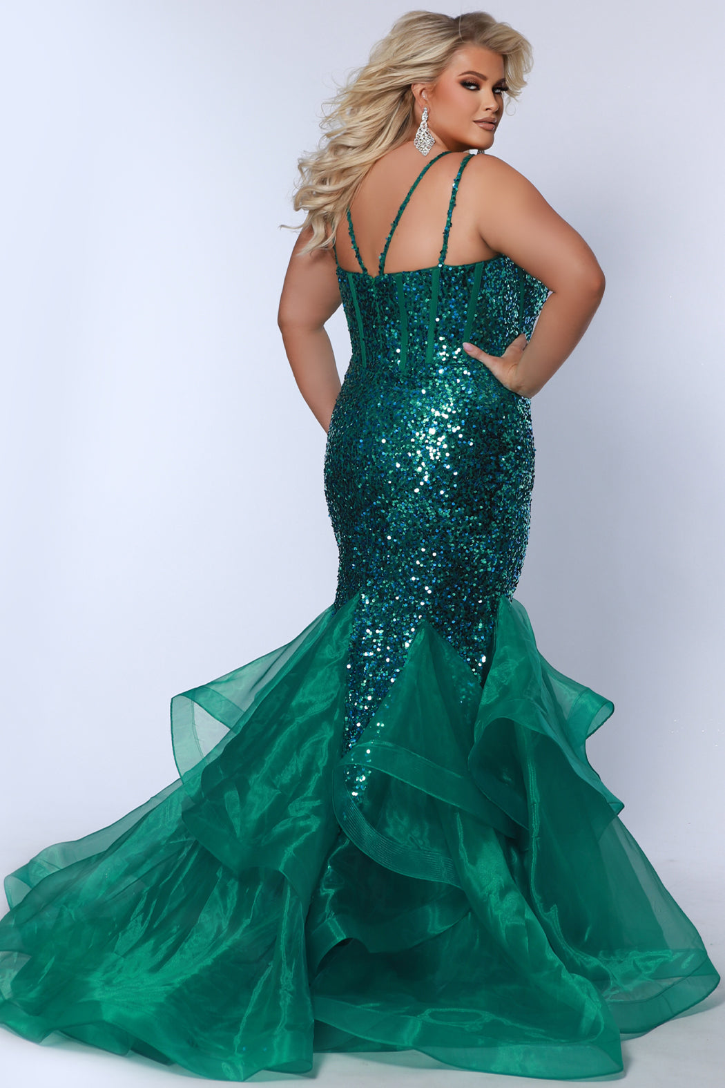 Plus Size fitted mermaid trumpet gown with exposed corset boning, double spaghetti straps and tiered skirt with godets and train. Bodice is covered in sequins and godets are a shimmer organza. Johnathan Kayne for Sydney's Closet style JK2516 in sherbet orange and pink or peacock blue and green.