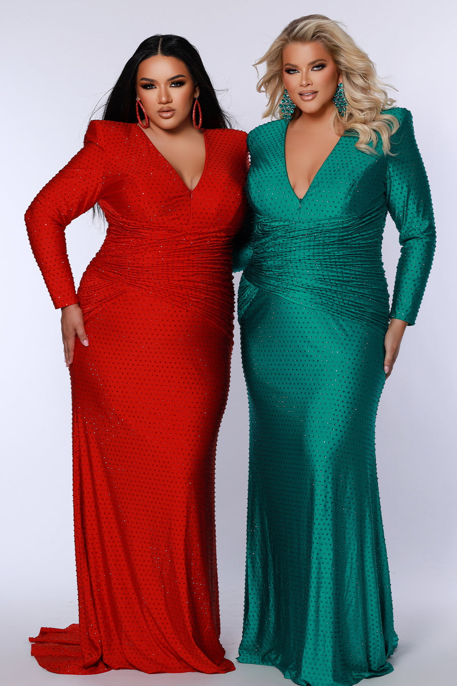Long sleeve plus size gala formal dress in emerald green, moonstone black and ruby red. Style JK2519 from Johanthan Kayne for Sydney's Closet in stretch lycra with hot fix stones, adjustable deep V neckline, ruched torso and slim skirt with train. 