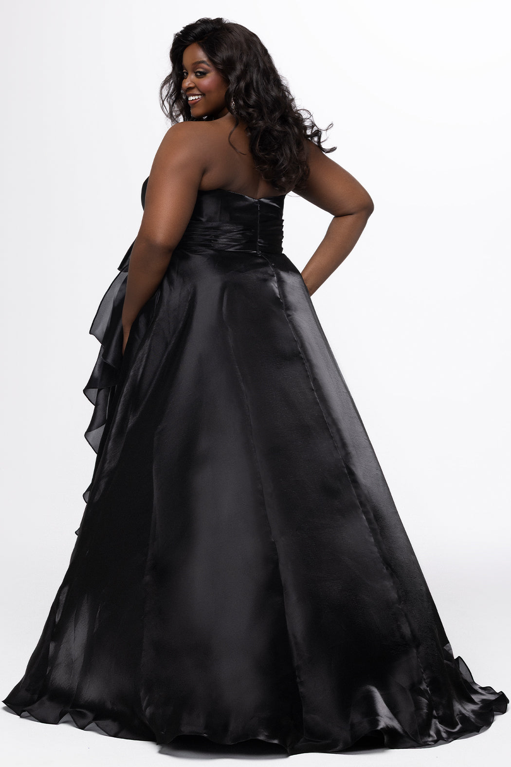 Johnathan Kayne for Sydney's Closet style JK2608.

Strapless sweetheart plus size A-line gown.  Ruched bodice with bow at natural waistline and flounce down left leg slit. Shiny organza fabric for lightweight comfort. Available in sizes  10-32 in Red, Black and Blue. 