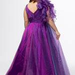 Johnathan Kayne for Sydney's Closet style JK2611. 

Plus size A-line gown made with multidimensional organza. Thick straps with detachable ruffle at shoulder. Ruched waistband with natural waistline and left leg slit with large ruffle. Deep v-neckline and center back zipper. Available in sizes 10-32 in purple and red. 