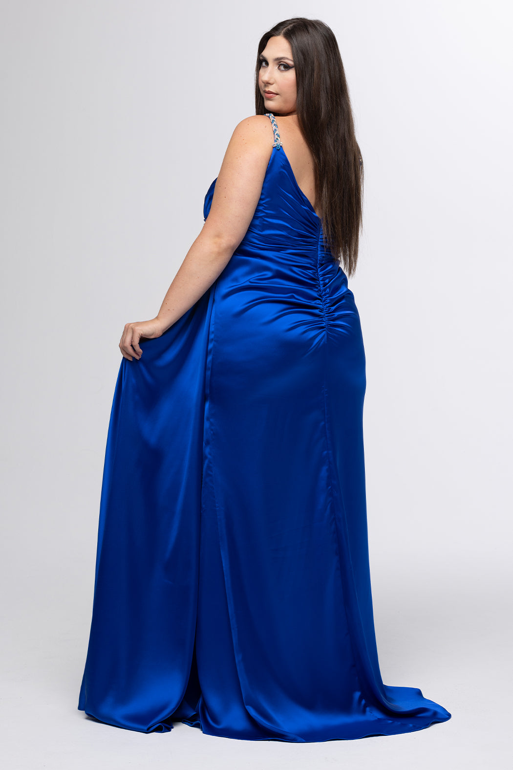 Johnathan Kayne for Sydney's Closet style JK2612. 

Plus size fitted satin gown. Braided beaded straps and V-neckline. Pleated bodice and ruched skirt with left leg slit and left side drape panel. Natural waistline and center back zipper. Available in sizes 10-24 in blue, black or white. 