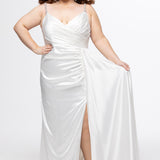 Johnathan Kayne for Sydney's Closet style JK2612. 

Plus size fitted satin gown. Braided beaded straps and V-neckline. Pleated bodice and ruched skirt with left leg slit and left side drape panel. Natural waistline and center back zipper. Available in sizes 10-24 in blue, black or white. 