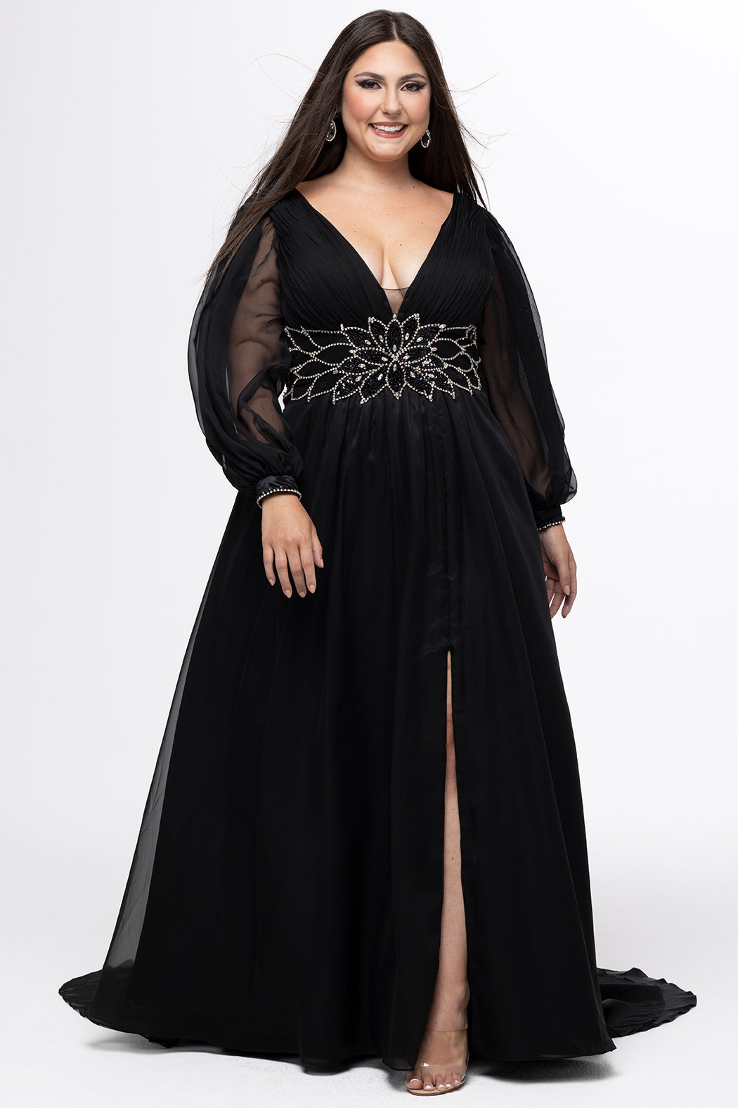 Johnathan Kayne for Sydney's Closet style JK2614. 

Plus size A-line chiffon gown with long bishop sleeves, beaded cuff and bicep slit. Bra-friendly straps, v-neckline and pleated bodice. Natural waistline with 4 inch beaded, rhinestone and sequin embellished waistband. Pockets, left leg slit with zipper, v-back and center back zipper. Available in sizes 10-32 in black, blue and red. 