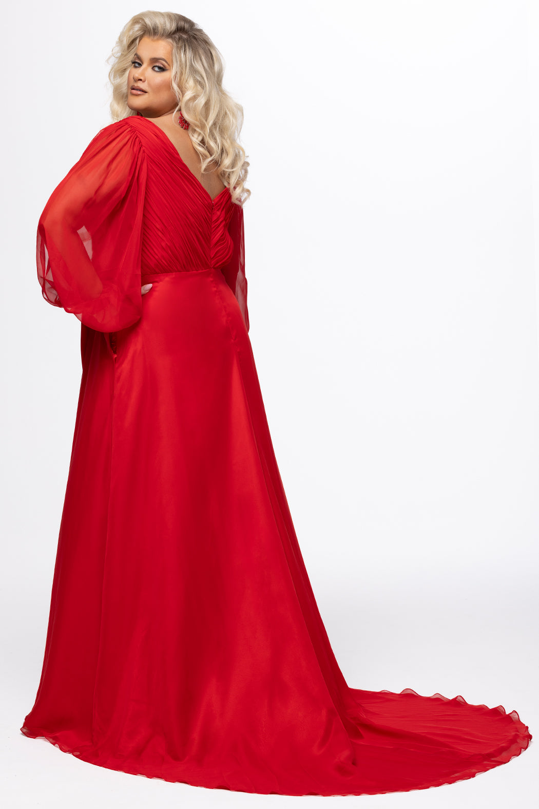 Johnathan Kayne for Sydney's Closet style JK2614. 

Plus size A-line chiffon gown with long bishop sleeves, beaded cuff and bicep slit. Bra-friendly straps, v-neckline and pleated bodice. Natural waistline with 4 inch beaded, rhinestone and sequin embellished waistband. Pockets, left leg slit with zipper, v-back and center back zipper. Available in sizes 10-32 in black, blue and red. 