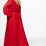 Johnathan Kayne for Sydney's Closet style JK2614. 

Plus size A-line chiffon gown with long bishop sleeves, beaded cuff and bicep slit. Bra-friendly straps, v-neckline and pleated bodice. Natural waistline with 4 inch beaded, rhinestone and sequin embellished waistband. Pockets, left leg slit with zipper, v-back and center back zipper. Available in sizes 10-32 in black, blue and red. 