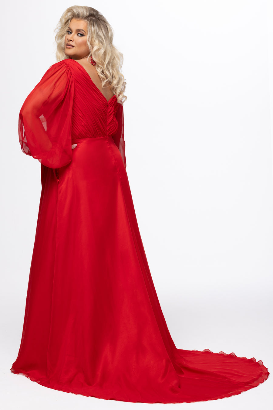 Johnathan Kayne for Sydney's Closet style JK2614. 

Plus size A-line chiffon gown with long bishop sleeves, beaded cuff and bicep slit. Bra-friendly straps, v-neckline and pleated bodice. Natural waistline with 4 inch beaded, rhinestone and sequin embellished waistband. Pockets, left leg slit with zipper, v-back and center back zipper. Available in sizes 10-32 in black, blue and red. 