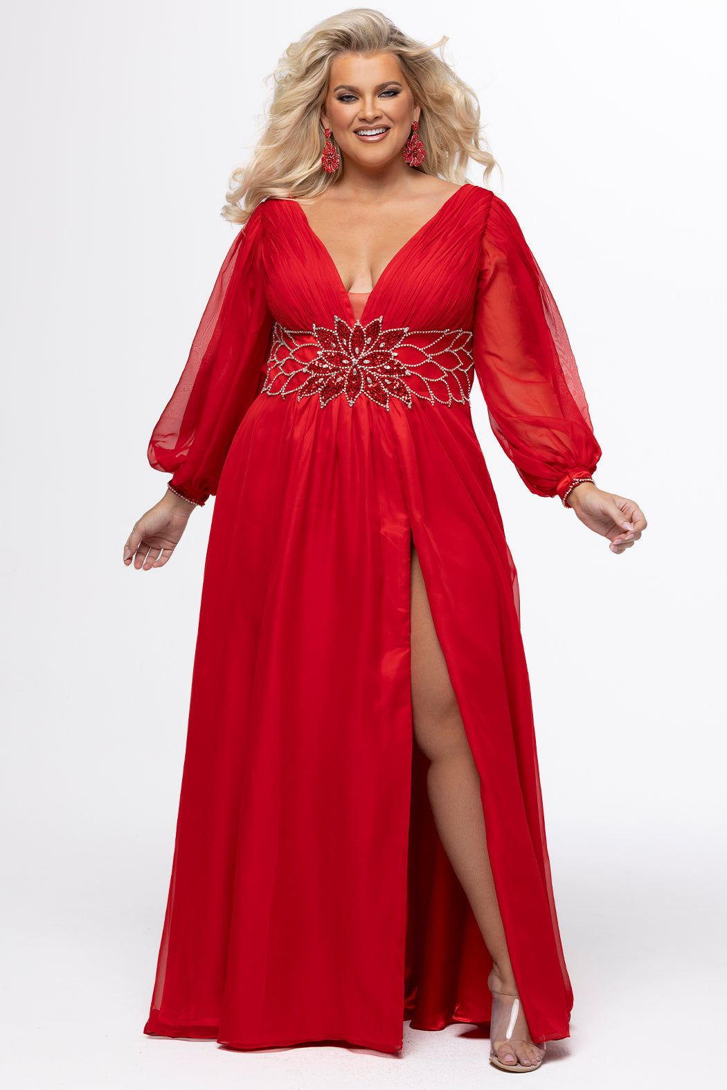 Johnathan Kayne for Sydney's Closet style JK2614. 

Plus size A-line chiffon gown with long bishop sleeves, beaded cuff and bicep slit. Bra-friendly straps, v-neckline and pleated bodice. Natural waistline with 4 inch beaded, rhinestone and sequin embellished waistband. Pockets, left leg slit with zipper, v-back and center back zipper. Available in sizes 10-32 in black, blue and red. 