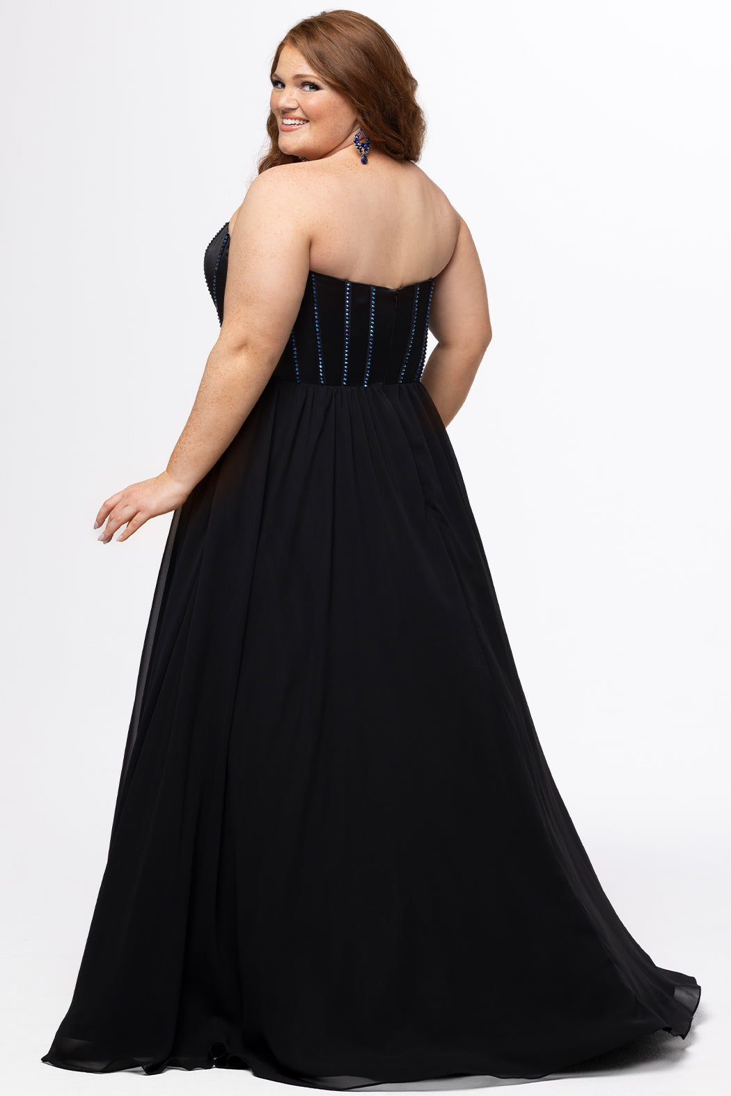 Johnathan Kayne for Sydney's Closet style JK2616. 

Strapless sweetheart plus size evening gown. Exposed bones covered in hot fix stones. Basque waist, chiffon A-line skirt, pockets, and left leg slit. Center back zipper. Available in sizes 10-32 in blue, black and red. 