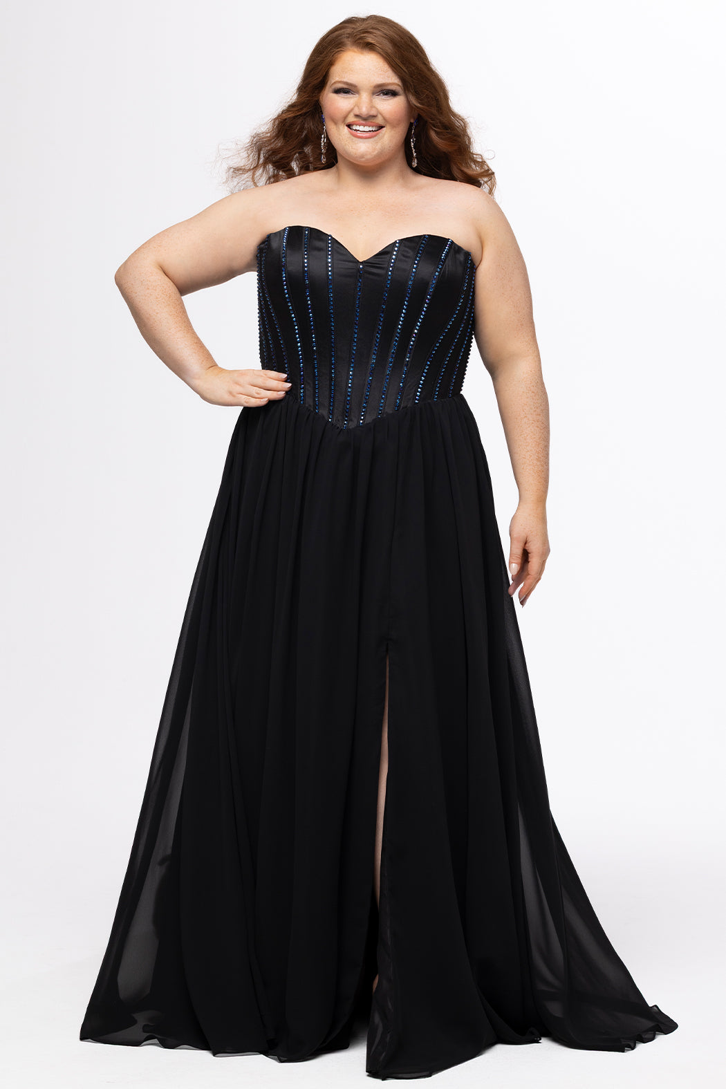 Johnathan Kayne for Sydney's Closet style JK2616. 

Strapless sweetheart plus size evening gown. Exposed bones covered in hot fix stones. Basque waist, chiffon A-line skirt, pockets, and left leg slit. Center back zipper. Available in sizes 10-32 in blue, black and red. 