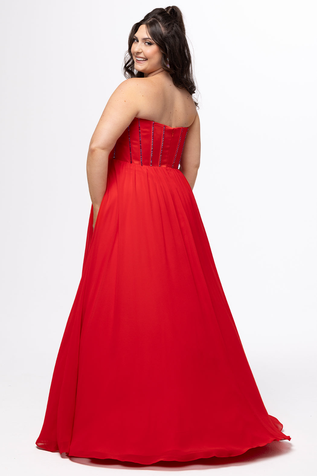 Johnathan Kayne for Sydney's Closet style JK2616. 

Strapless sweetheart plus size evening gown. Exposed bones covered in hot fix stones. Basque waist, chiffon A-line skirt, pockets, and left leg slit. Center back zipper. Available in sizes 10-32 in blue, black and red. 