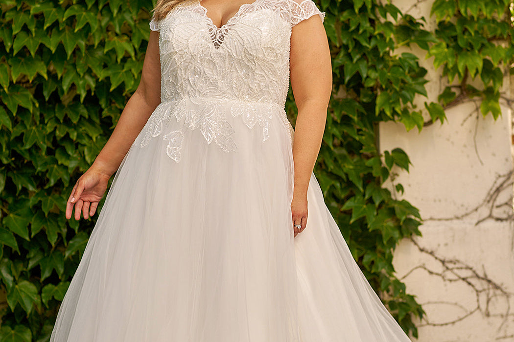 Michelle Bridal style MB2309 plus size bridal gown with modern lace appliques, hand beading, cap sleeve and long tulle skirt. Available in black or ivory. Only sold in stores.
