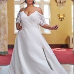 Michelle Bridal 2406. Lace and bridal satin, A-line silhouette,  V-neckline, Spaghetti straps, Optional drop lace sleeves, V-back with invisible zipper covered in 30 buttons. Natural waistline, Aline skirt with slit starting 15 inches below waist, Pockets on each side seam