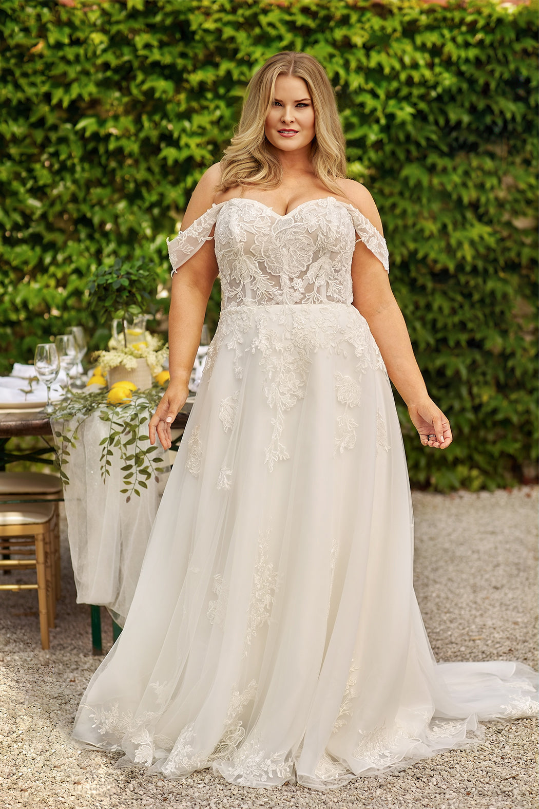 Michelle Bridal MB2413 Ivory. Floral lace appliques with bugle beads and clear sequins, Soft bridal tulle,  Organza, Satin, horsehair hem, A-line, Sweetheart neckline, exposed corset boning, Strapless, Off the shoulder drape sleeves, Bodice unlined, Nude cups included, Optional finished bodice included, Natural waistline, Long invisible center back zipper.