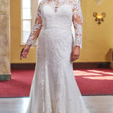 Michelle Bridal MB2423 Ivory. lace covered sleeves, Keyhole back ,Leaf and floral embroidered appliques on net, Soft bridal tulle, Sparkle tulle, Light satin lining, Light lining, Clear sequins, bugle beads, cut glass, Fitted silhouette, sweetheart neckline, lace covered illusion.