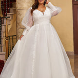 Michelle Bridal MB2429 Ivory. Bridal tulle, bridal tulle, Satin lining,  Appliques = Embroidered lace appliques, Guipure Lace trim, Silhouette: A-line, V-neckline, Ivory mesh insert Detachable, Puff Sleeve = long sleeve with cuff, Front bodice is lined, Back bodice has optional lining with snaps, Natural waistline.