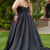 Strapless satin plus size wedding gown with pleated bodice and detachable belt included. A-line skirt with box pleats, pockets and long train. Michelle Bridal style MB2523 is available in ivory or black. 