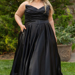Strapless satin plus size wedding gown with pleated bodice and detachable belt included. A-line skirt with box pleats, pockets and long train. Michelle Bridal style MB2523 is available in ivory or black. 