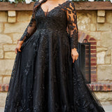 MB2604 by Michelle Bridal

Available in Black, Ivory, Black on Ivory, Ivory on Black, Ivory on Champagne and Black on Champagne. 

Plus-size model wearing a black A-line wedding gown with sheer long sleeves, a deep V-neckline, and intricate lace appliqué with subtle shimmer throughout the full skirt, photographed outdoors in front of a stone backdrop.