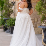 Michelle Bridal MB2611 shown in Ivory/Nude. 
Strapless bodice with deep v-neckline, exposed boning and optional drape straps with beaded detail. Soft bridal tulle A-line skirt with floral appliques, center back zipper. 