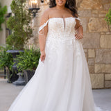 Michelle Bridal MB2611 shown in Ivory/Nude. 
Strapless bodice with deep v-neckline, exposed boning and optional drape straps with beaded detail. Soft bridal tulle A-line skirt with floral appliques, center back zipper. 