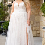 Michelle Bridal MB2613 shown in Rosewater. 
Beaded double spaghetti straps, v-neckline, natural waistline. 3D floral appliques, soft bridal tulle, satin lining. A-Line skirt with left leg slit. Scoop back and center back zipper. 