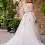 Michelle Bridal MB2614 in Floral. 
Strapless scoop bodice, cat eye detail, pink and blue floral appliques. Natural waistline, A-line skirt, tulle and sparkle tulle layers over lightweight soft pink satin lining. Horse hair hem, scoop back and center back zipper. 