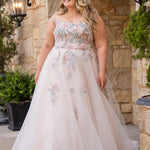 Michelle Bridal MB2614 in Floral. 
Strapless scoop bodice, cat eye detail, pink and blue floral appliques. Natural waistline, A-line skirt, tulle and sparkle tulle layers over lightweight soft pink satin lining. Horse hair hem, scoop back and center back zipper. 