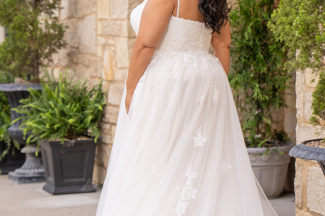 Michelle Bridal MB2617 shown in Ivory. 

Spaghetti straps, v-neckline, natural waistline. Floral appliques, soft bridal tulle, lightweight satin lining. Ballgown skirt with appliques detail. Long train, straight across back and center back zipper.  