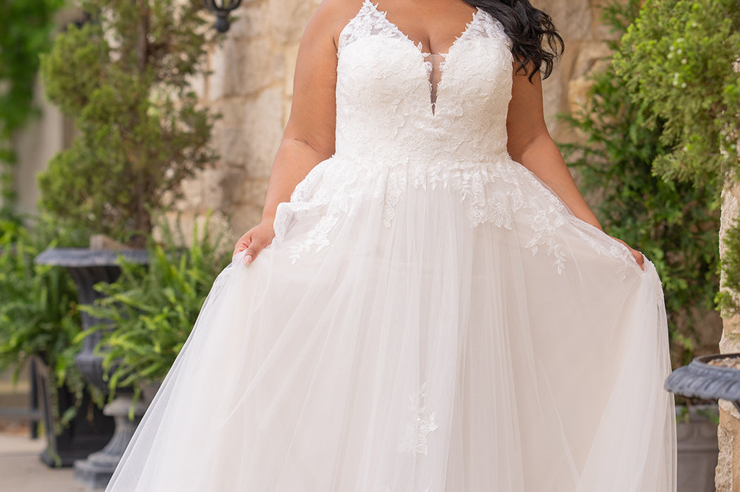 Michelle Bridal MB2617 shown in Ivory. 

Spaghetti straps, v-neckline, natural waistline. Floral appliques, soft bridal tulle, lightweight satin lining. Ballgown skirt with appliques detail. Long train, straight across back and center back zipper.  