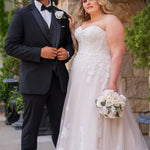 Michelle Bridal MB2618 shown in Sand. 

Strapless sweetheart ballgown. Soft bridal tulle, floral lace appliques, lightweight satin lining. Natural waistline, A-Line skirt. Bicep optional puff sleeves. Straight across back, center back zipper, train and covered buttons. 