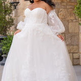 Michelle Bridal MB2618 shown in Ivory. 

Strapless sweetheart ballgown. Soft bridal tulle, floral lace appliques, lightweight satin lining. Natural waistline, A-Line skirt. Bicep optional puff sleeves. Straight across back, center back zipper, train and covered buttons. 