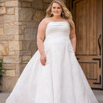 Michelle Bridal MB2619 shown in Ivory. 

Strapless straight across neckline with 3 inch bodice fold over cuff. Soft brocade gown with princess seams and no defined waistline. A-line skirt, horsehair hem, long train and center back zipper. 