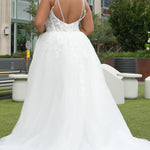 Michelle Bridal MB2620 shown in Ivory. 

Bridal ballgown with many layers of soft tulle and crinoline and satin lining. V-neckline, beaded straps, sheer bodice with floral appliques. Natural waistline and optional bodice lining. Long train and center back zipper. 